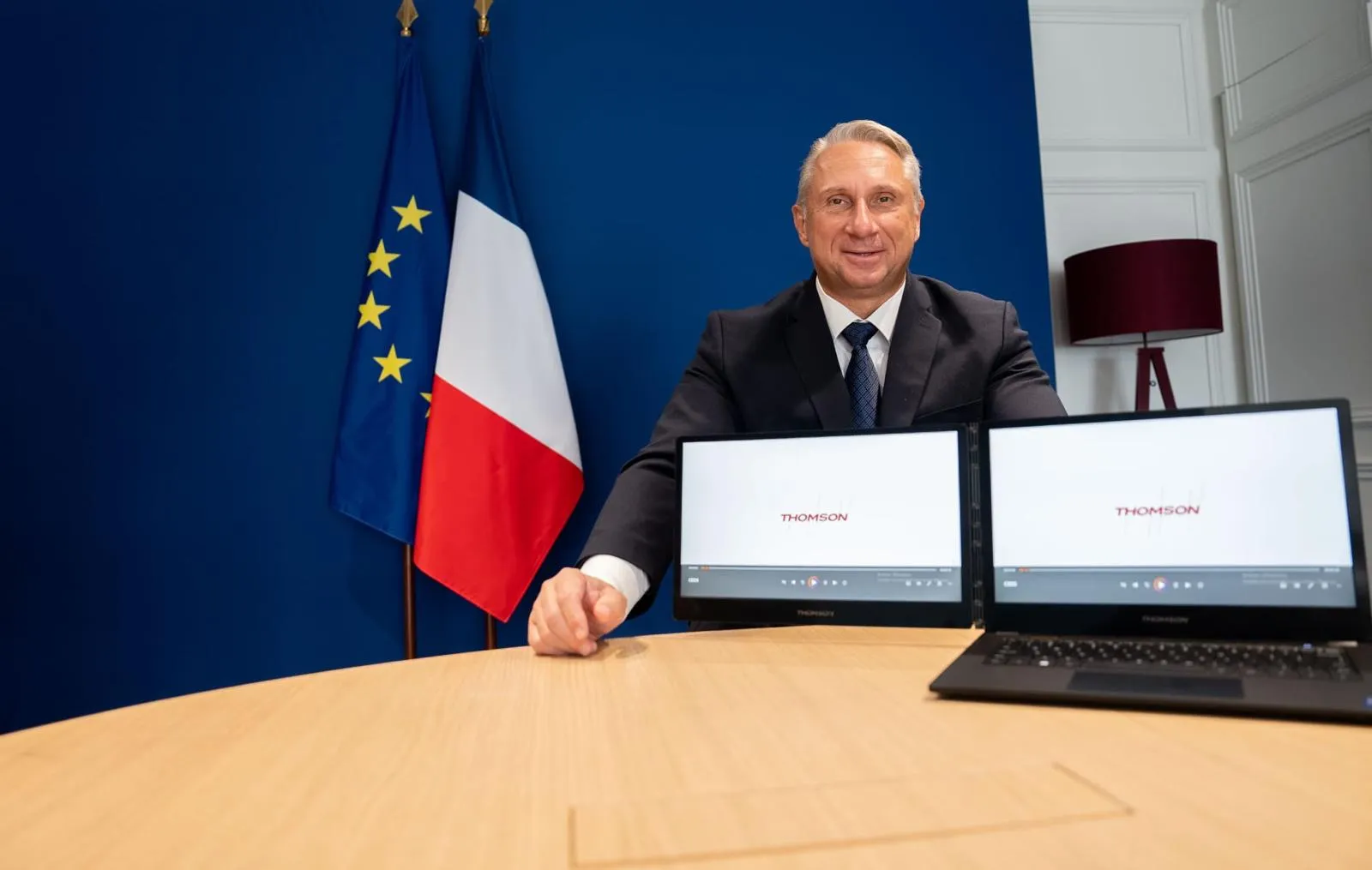 Thomson CEO with a laptop